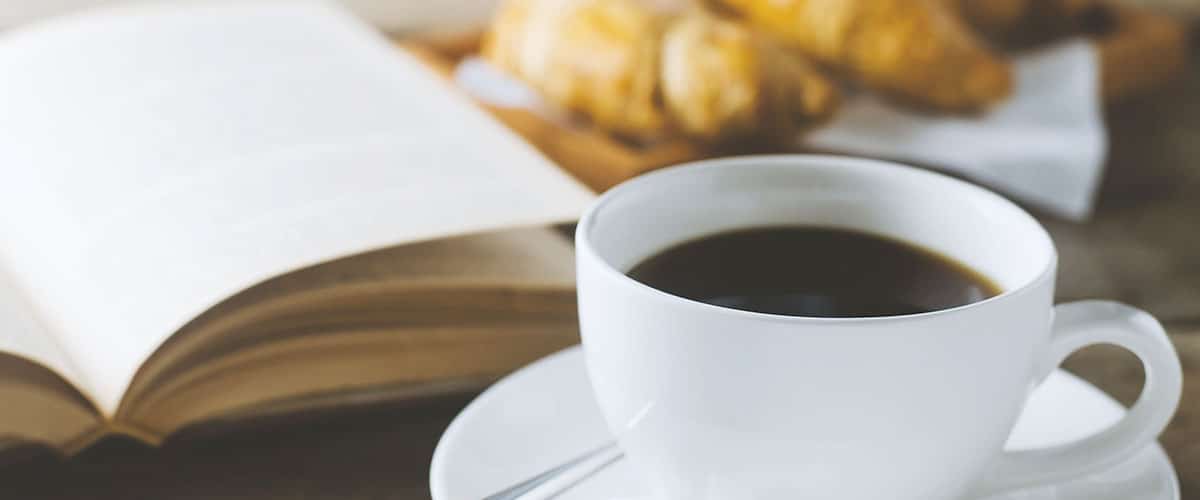 book with coffee and pastry